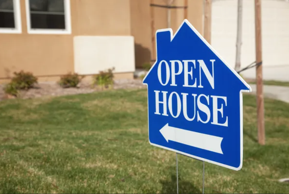 A blue open house sign in the front yard of a house - 1 (800) 880-7954