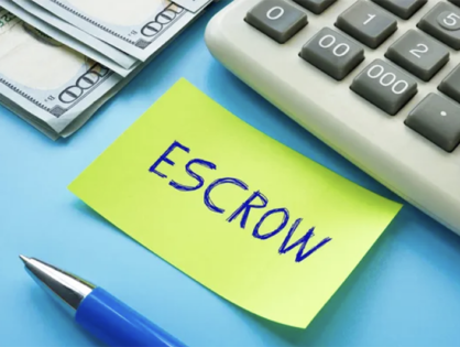 Escrow words written on a piece of paper with a pen next to a calculator and $100 bill - 1 (800) 880-7954